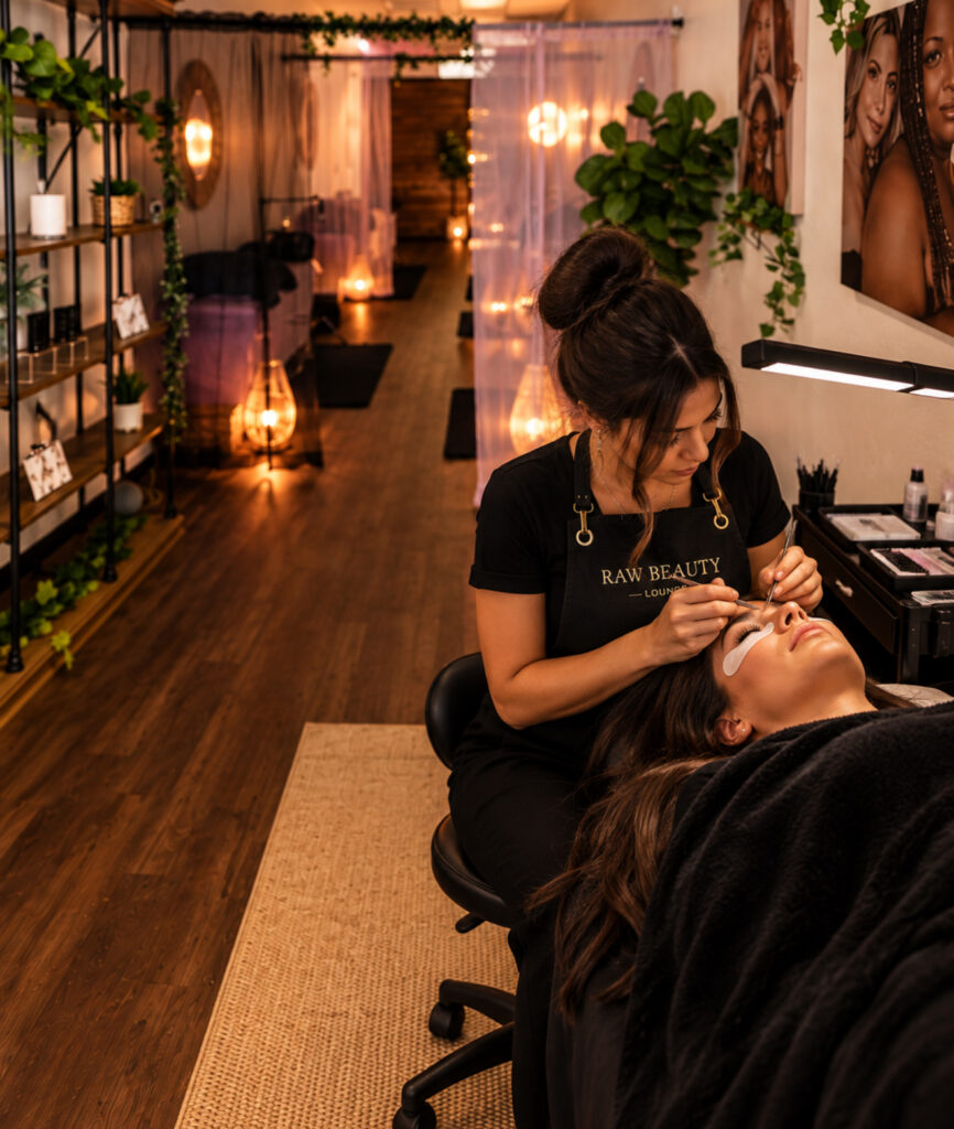 Lashes west side Lash artist applying extensions to a client in the Glendale salon